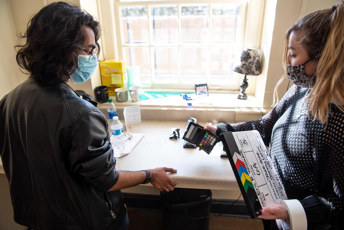 Students Sammy Lahiri (left) and MacKenzie Kress (right) discuss a virtual reality project in between scenes