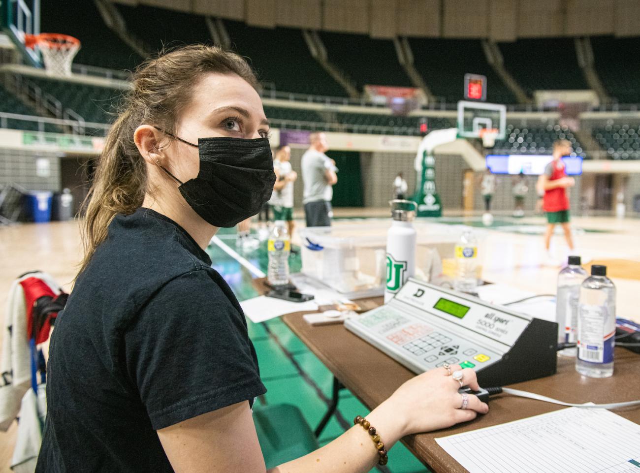 Jess North controls the shot clock during practice