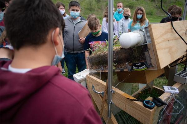 Vinton County Middle School students of Shem Smith record data on temperature on a green roof