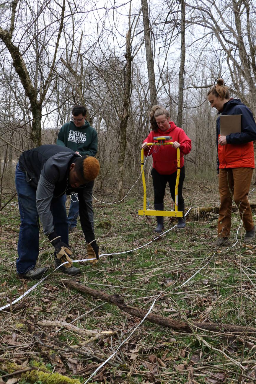 Students using a soil resistance meter.