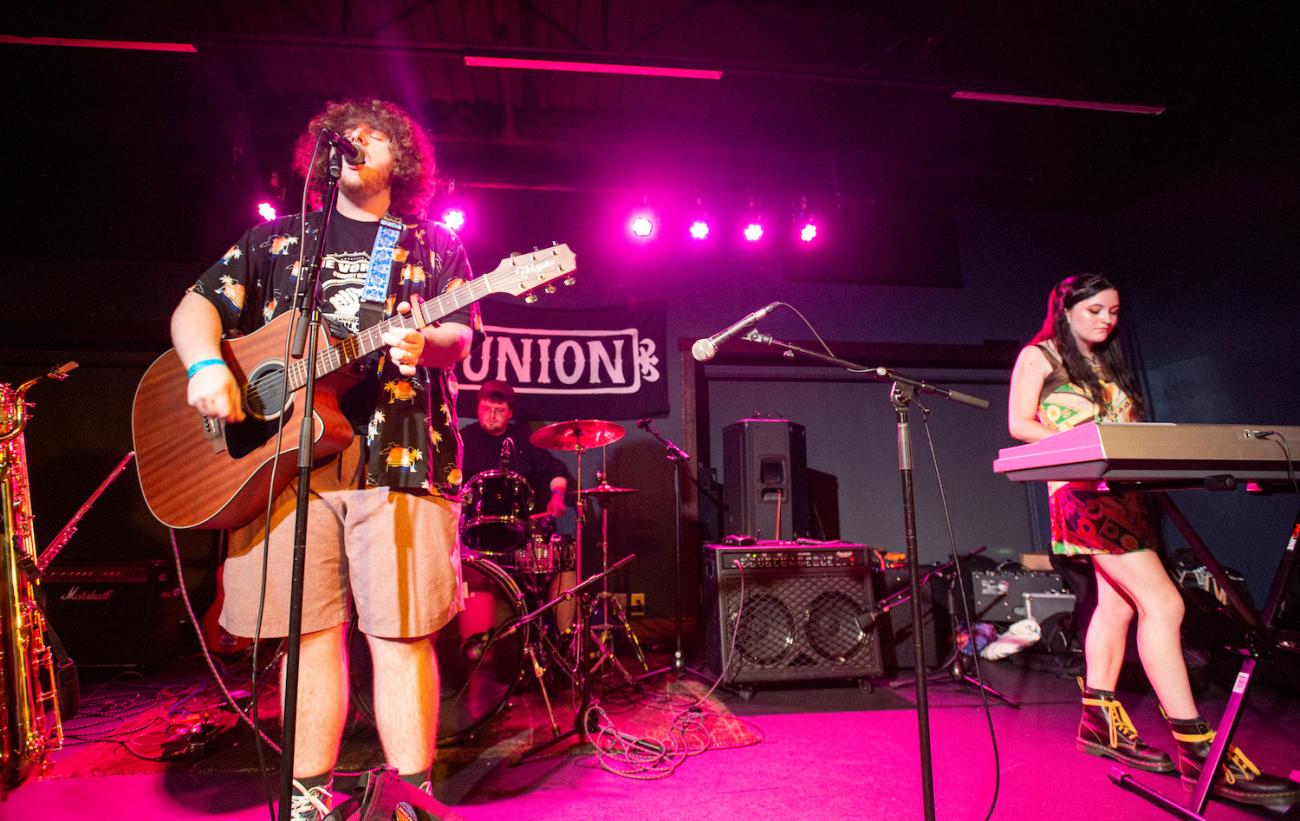 Nathan Cain, Joe Ash, and Mariana Stockman of Plastic Lemonade perform onstage at The Union. 