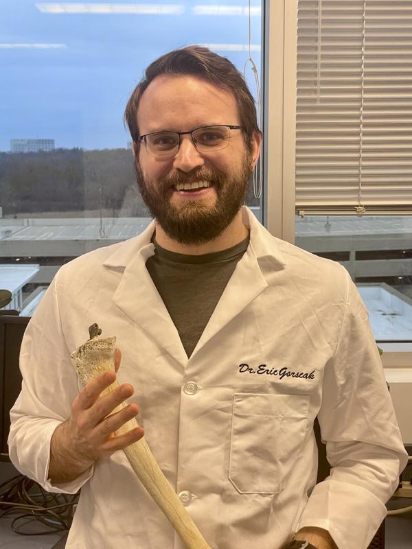 Dr. Eric Gorscak is a faculty member at Midwestern University, shown here in the lab coat.