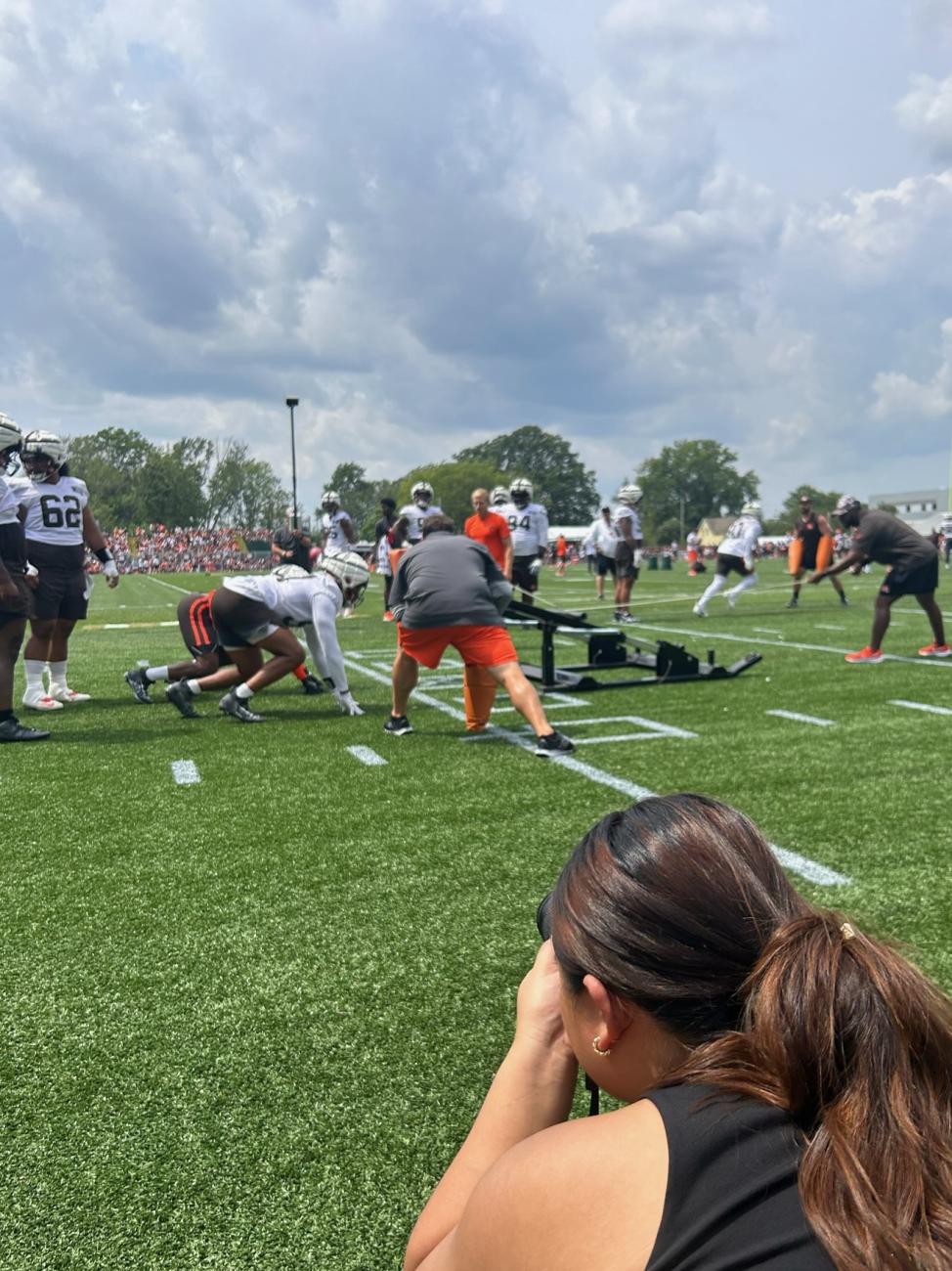 Ao take photographs during the Cleveland Browns training camp. 