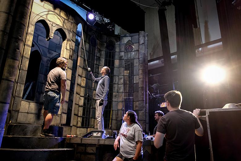 OHIO theater students and touring production staff build the set for Beauty and the Beast.