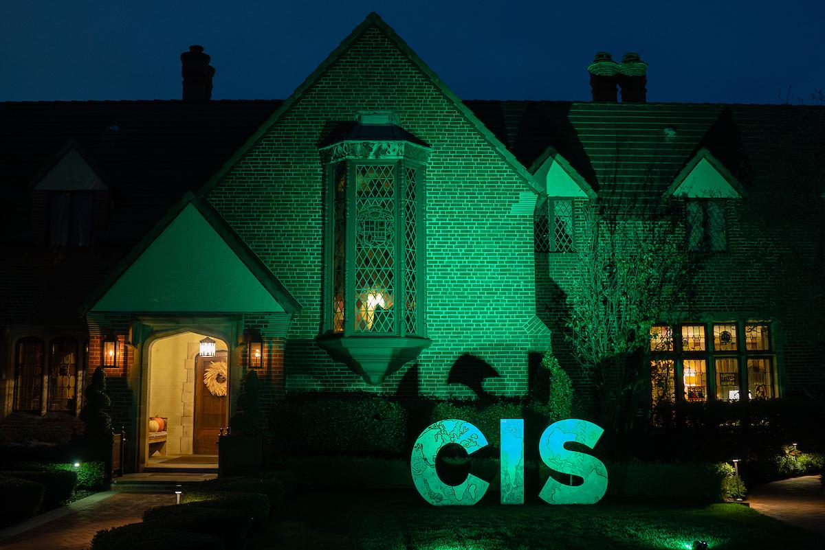 The letters "CIS" are shown lit up outside the Zenner House