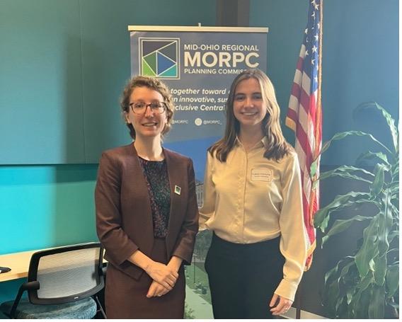 Claire Payauys poses with a member of the Mid-Ohio Regional Planning Commission