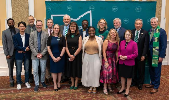 The winners of Global Engagement Awards and speakers from the event pose for a photo in the Baker Ballroom