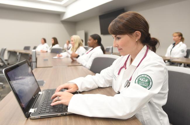 OHIO Nurse Practitioner program student working form their laptop.