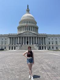 Victoria Crawford standing in front of the US Capital building