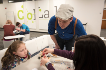 Students and their siblings participate in a remote control car building activity at the CoLab in Alden Library during Sibs Weekend on Feb. 2, 2019.