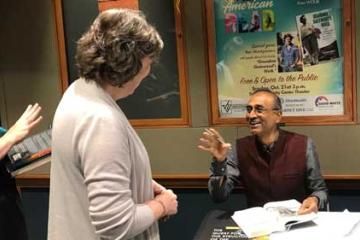 Dr. Venki Ramakrishnan enjoys signing books.