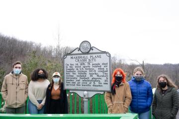 Students from the Journalism and Trauma class visit the site near Tri-State Airport near Huntington