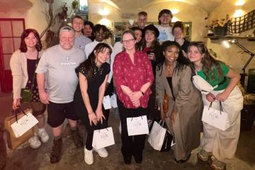 OHIO students involved in the Florence Retail Tour pose for a photo inside of a business