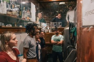 Michael Held and Art Oestrike, top right, take their class behind the scenes to help brew 