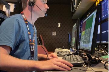 An OHIO alumnus sits at a computer