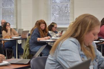 Students in class writing