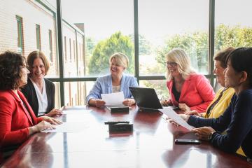  Ohio University Innovation Center’s all-female staff gather at the West State St. facility: [LEFT to RIGHT] Client Services Manager and Executive Coach Erin Rennich, MBA ’13; Accountant Jennifer Pauwels; Director Stacy Strauss; Associate Director Tanya Conrath, BSC ’93; Administrative Specialist Susan Bauman, BSED ’94; and Lab Director Misako Hata, BSISE ’98, MS ’01, MS ’10. Photo by Ellee Achten, BSJ ’14, MA ’17