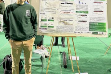 Benjamin Stiadle is shown with his research project at the Student Research Expo