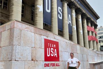 Lisa Milne poses in front of the Team USA House during the 2024 Olympic Games