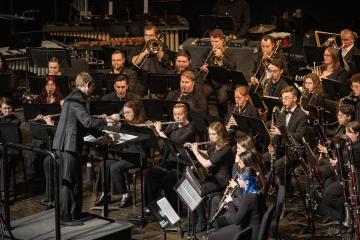 The Ohio University Wind Symphony is shown performing