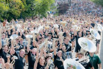 Students walk up Richland Avenue in Athens during Welcome Week 2024