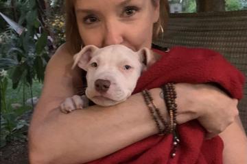 Eileen Marsal Koch is shown holding a dog