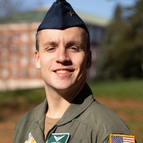 Devin Pall smiles at the camera, wearing his Air Force uniform.