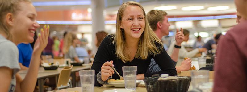 Student eating in dining court