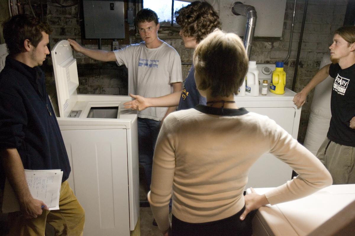 Ecohouse students demonstrate the energy-efficient appliances.