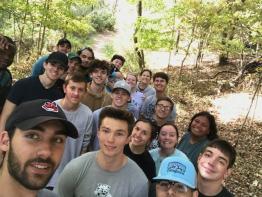 Students hiking in the woods.