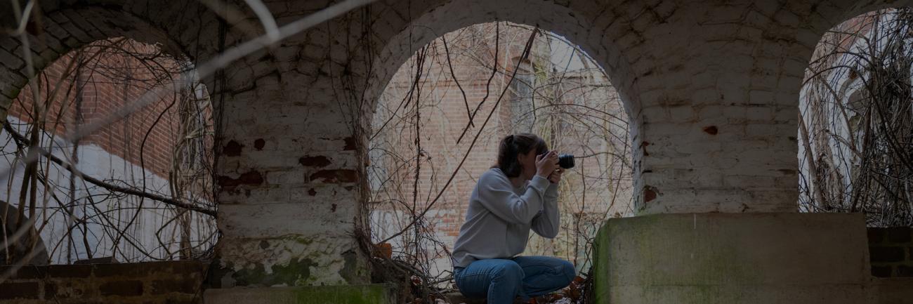 Ohio University student Zoe Cranfill taking a photo at The Ridges