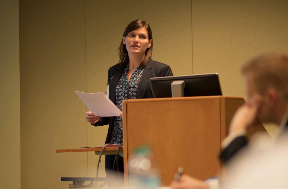 Sarah Conley Ballew at podium in meeting