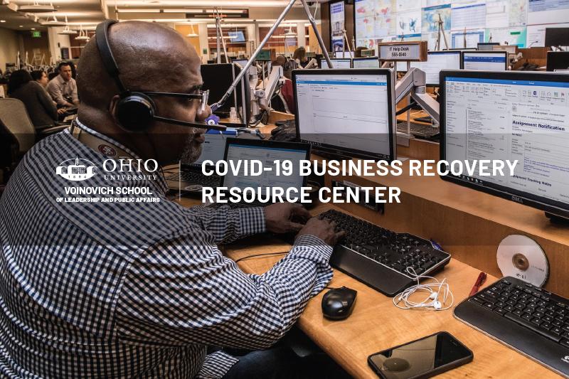 Man working on computer in call center